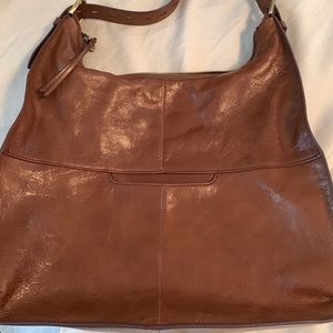 Dust bag included.  Small scuff on front of bag